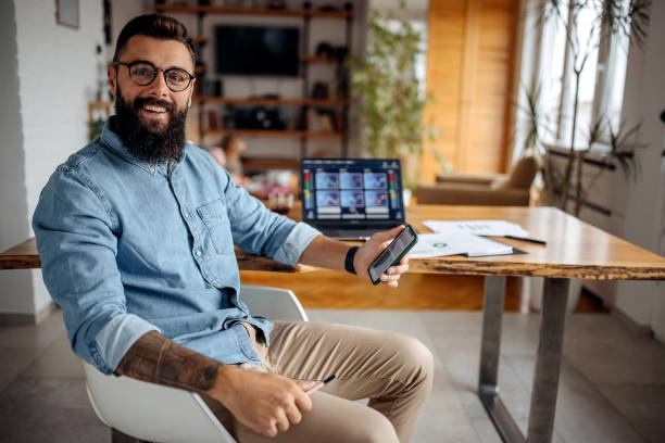 Exchange trader and cryptocurrency investor posing at his home office